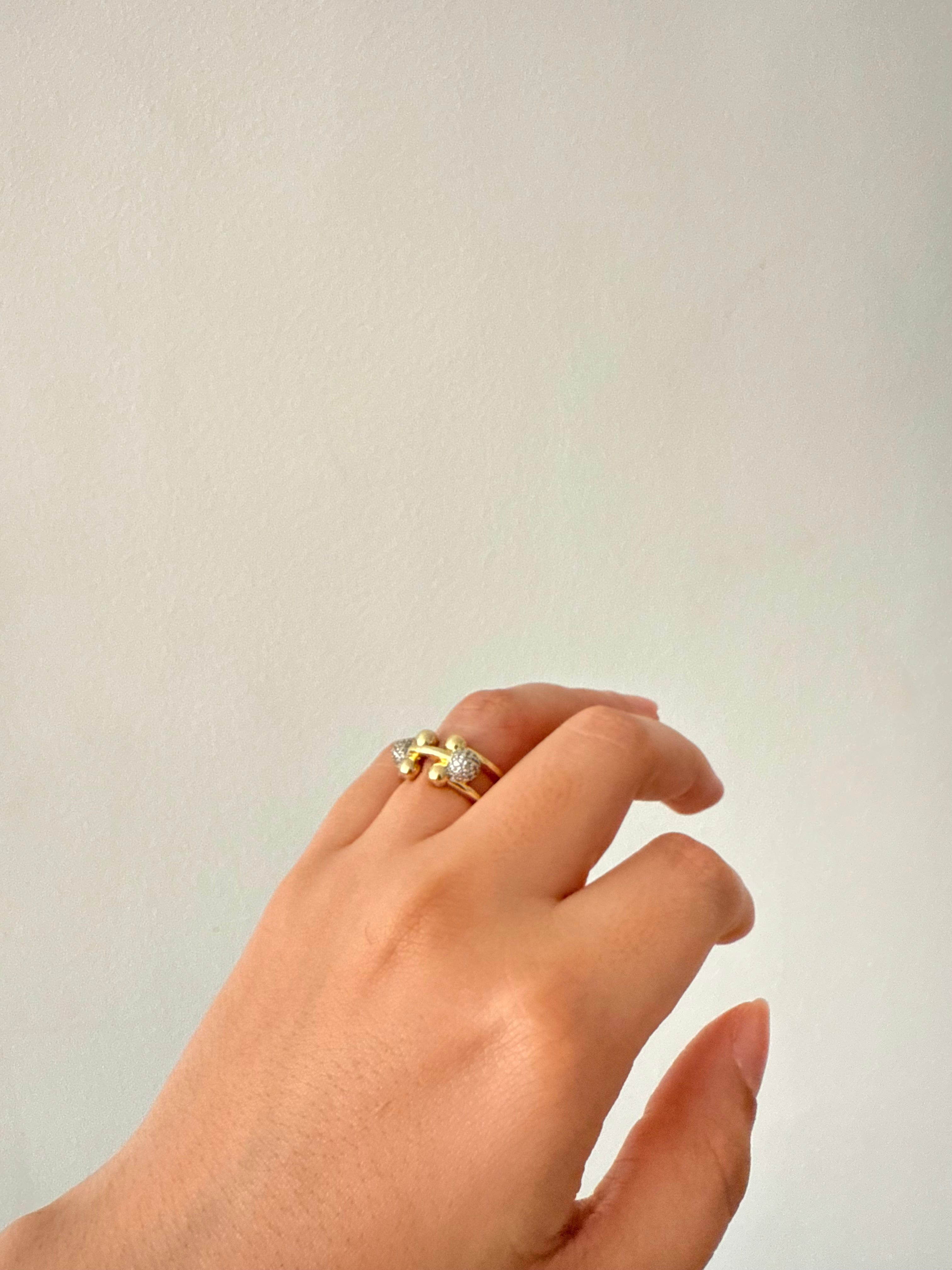 The silver clip gold ring